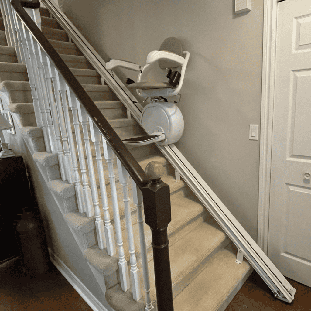 Home stairlift installed on staircase for mobility assistance.