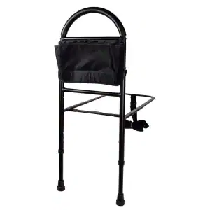 Bedside rail for elderly care with black frame and fabric pouch.