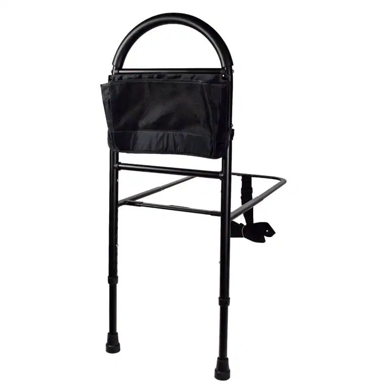 Bedside rail for elderly care with black frame and fabric pouch.